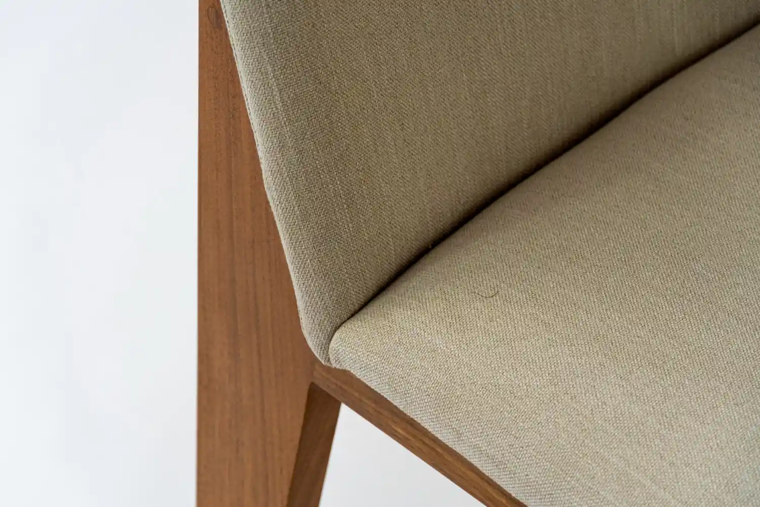 Oatmeal woven contract fabric on the seat and back of a light oak restaurant dining chair